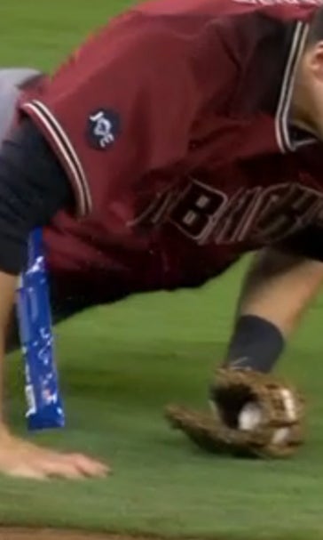 Diamondbacks shortstop dives for a ball and loses his sunflower seeds